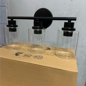 3 light matte black vanity light with clear glass